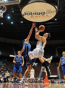 Gilbert Christian's Logan Foughies 
goes high to score two of his 14
points in a semifinal win. 