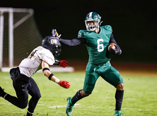 Jerry Mixon Jr. (6) is being recruited as a linebacker but was also state champion Sacred Heart Cathedral's leading rusher.