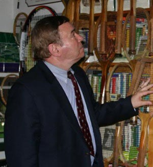 Dr. David Flakoll with his hundreds of vintage
tennis racquets.