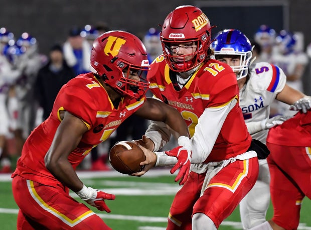 Cathedral Catholic quarterback Charlie Mirer hands to Lucky Sutton. 
