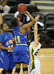 St. Bernard freshman LeJahna Drummer
tied to keep her team close
with 16 points and 10 rebounds.