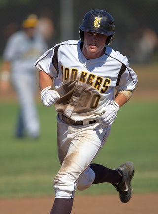 Max Stassi rounds the bases after a home run.