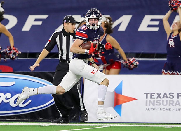 Ryan receiver Keagan Cunningham races along the sideline for a 48-yard touchdown reception during the first half.