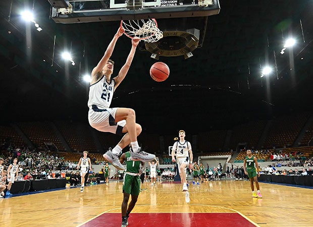 Amondo Miller of Valor Christian (Colo.) finishes a dunk during CHSAA 5A Great 8 playoff game against George Washington at the Denver Coliseum.
