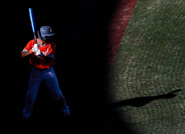 Caprock's (Texas) Jose Reynoso is silhouetted while standing on deck during the Longhorns' game against Dumas.