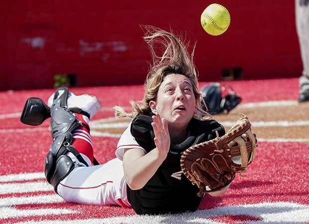 A Glen Rose (Texas) catcher makes a diving attempt for a foul ball against Midlothian Heritage.