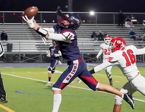 Receiver Mason Galbreath of Datoka Ridge (Colo.) stretches for a touchdown catch during a victory over Montrose in the first round of the CHSAA 4A state playoffs.