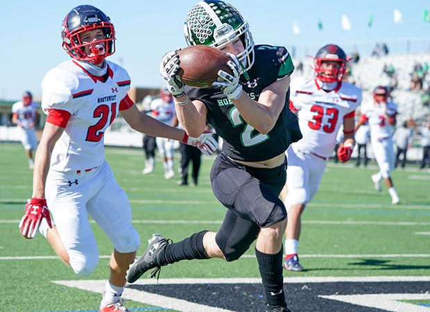 Receiver Kaden Taylor of Azle (Texas) makes a spectaular over-the-shoulder catch in the end zone against visiting Northwest.
