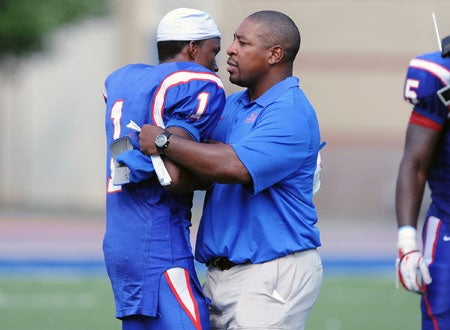 Elijah Brooks, right, with Charlie Jordan after the game.