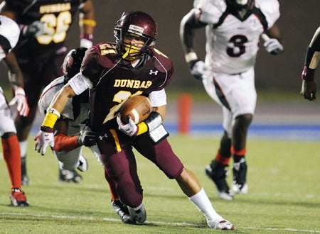 Paki Brown carries for Baltimore Dunbar against Washington Dunbar.