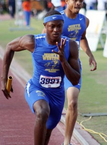 Artie Burns is one of the nation's top
hurdlers, but his first love is football.