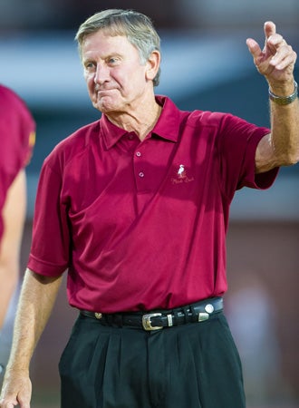 Steve Spurrier waves to the crowd at his alma mater.