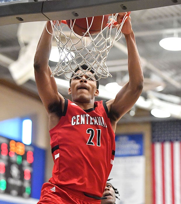 Aaron McBride with a first-half dunk for Centennial.