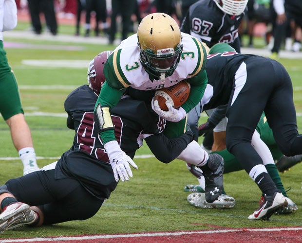 St. Joseph Regional (N.J.) running back Troy Gethers leaps over a Wayne Hills defender for a touchdown.