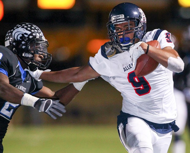 Allen (Texas) receiver Jalen Guyton attempts to elude a Plano West defender.