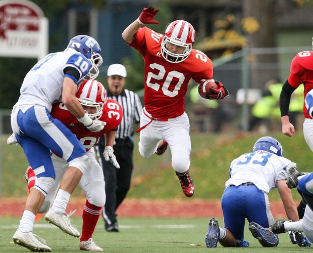 Red Jacket (N.Y.) running back Daniel Colasurdo soars while carrying the ball during a Section 5 Class D semifinal game against Geneseo.