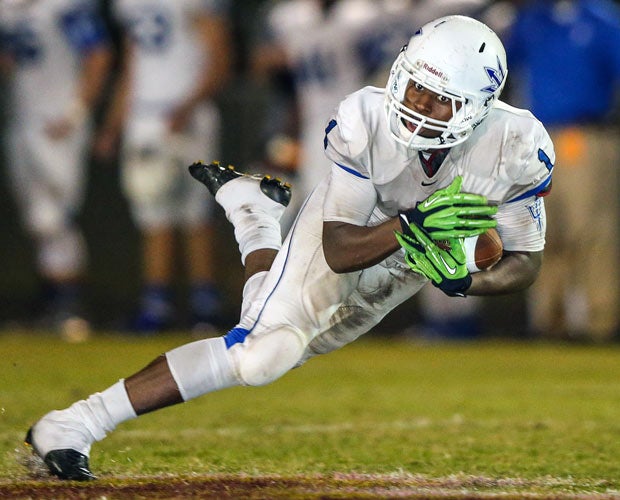 A Clay (Fla.) receiver makes a diving catch against St. Augustine.