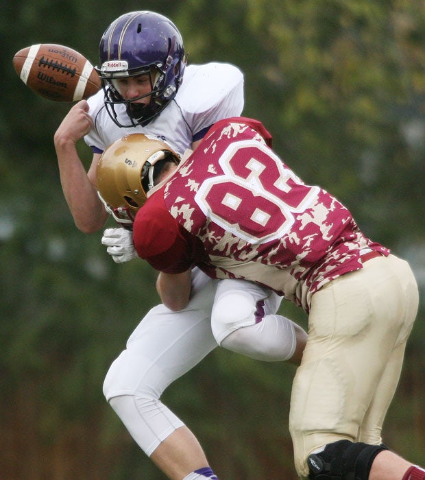 A Bayfield (Colo.) player fumbles while being hit by Faith Christian's Grant Harkness during a CHSAA 2A playoff game.