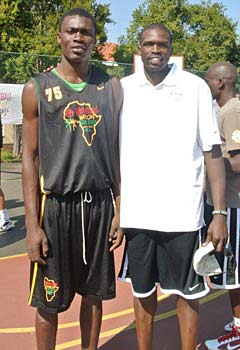 Aflakpui (left) with Chicago Bulls forward Luol Deng at NBA Basketball Without Borders in South Africa.