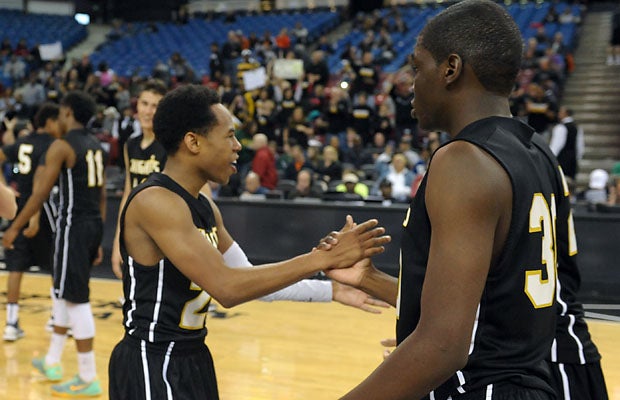 Bishop Montgomery senior Justin Bibbins congratulates teammates following a resounding 85-44 Division IV win over Moreau Catholic Saturday at Sleep Train Arena. 