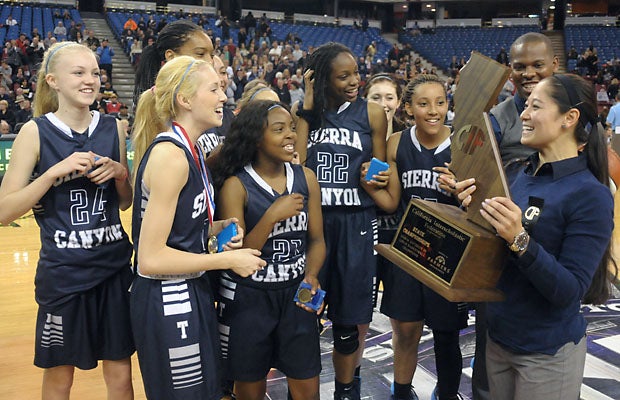 Sierra Canyon celebrates its second-straight CIF state championship. Saturday it won a Division IV crown with a 64-37 win over Justin-Siena. Last year it won a Division V crown. 