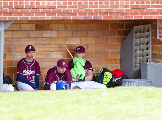 Some Bethel High players relax in the dugout.