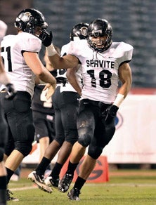 Servite three-year starter Butch Pauu
was in a celebratory mood following
his team's season-opening 20-0 win 
over Oceanside on Thursday. 