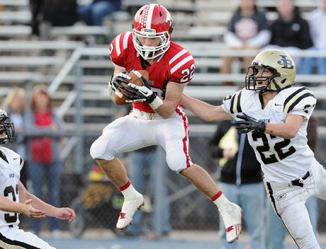 Milone makes a leaping catch at the goal line in scoring one of his 14 receiving touchdowns last fall.