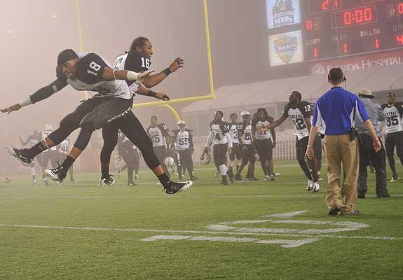 Rockets players celebrate in the fog after downing Dr. Phillips in Florida's 6A final.