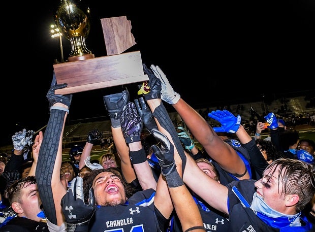 Chandler players hoist the Arizona Open Division trophy Saturday after winning their fifth straight title.