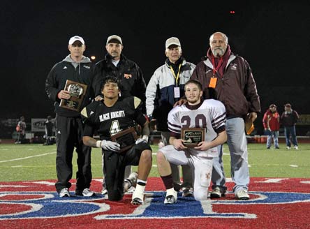 Caledonia-Mumford coach Mike Monacelli (back row, right).