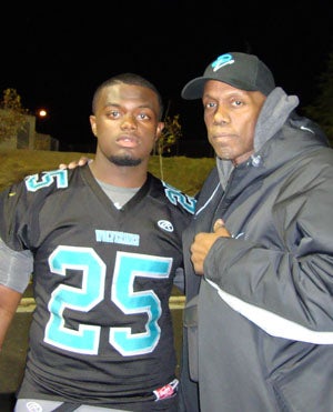 Malik (left) and his father Mike Hutchings.