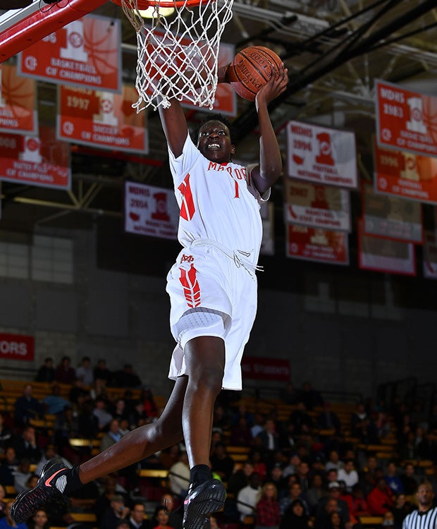 Mater Dei's Bol Bol soars in for a dunk.