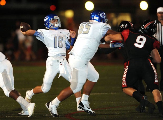 Bishop Gorman sophomore quarterback Tate Martell led a furious fourth quarter comeback with his arm and legs. Here he gets tremendous protection from guard Sione Lasike (65).