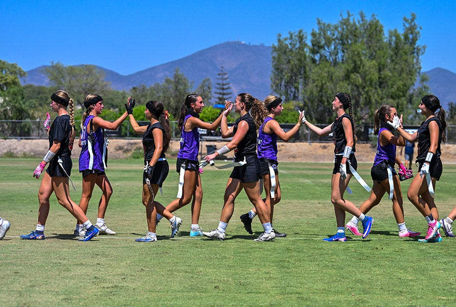 JSerra Catholic and Carlsbad players exchange high fives after their game Friday at the Elite Athlete Training Center in Chula Vista. (PHOTO: Dale Edwards)