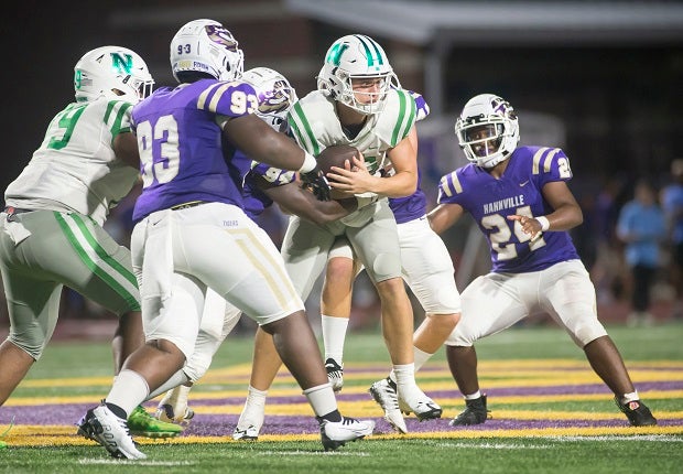 Newman's Arch Manning is bottled up in the first half of the Greenies' 35-14 win over Hahnville on Friday.