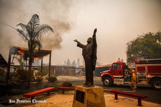 A haunting image in front of the school shortly after the fire began on Oct. 8.