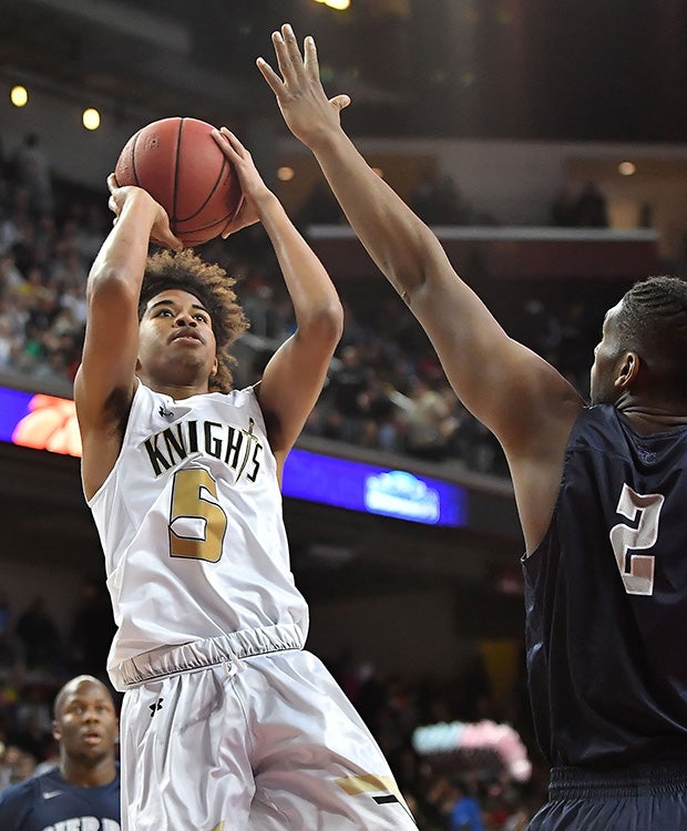 Bishop Montgomery guard Ethan Thompson takes a jump shot in front of Sierra Canyon's Cody Riley.