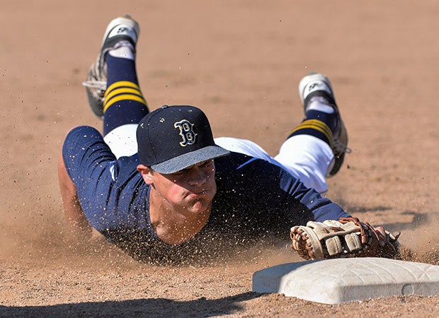 Bonita Vista (Chula Vista, Calif.) first baseman Isaac Burow dives while recording an unassisted out at first during a game against Granite Hills.