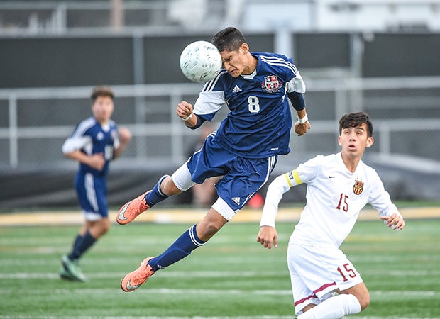 Montgomery (San Diego, Calif.) midfielder Oscar Godinez connects on a header against Mission Hills in the CIF San Diego Section Division 2 championship game.