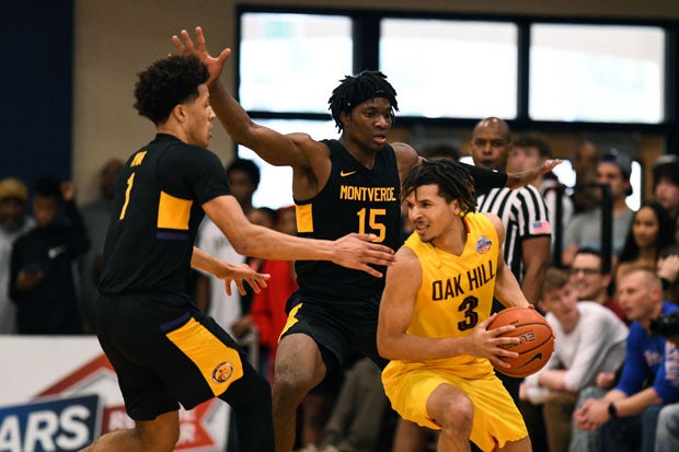 Montverde Academy's Precious Achiuwa (15) and Cade Cunningham (1) surround Cole Anthony (3).