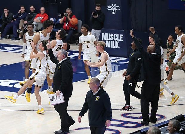 O'Dowd players and coaches celebrate following Jalen Lewis' game-winning shot. 