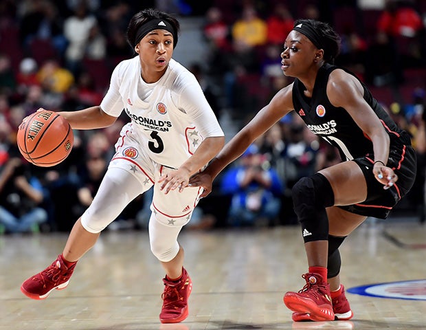 West point guard Alexis Morris of Legacy Christian Academy dribbles past an East defender.