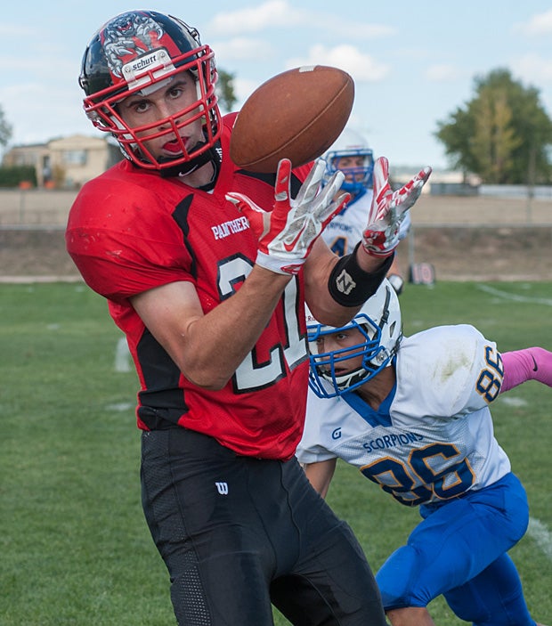 Colton Smith of Peyton (Colo.) looks into the camera as he hauls in the catch against Dolores Huerta Prep (Pueblo, Colo.).