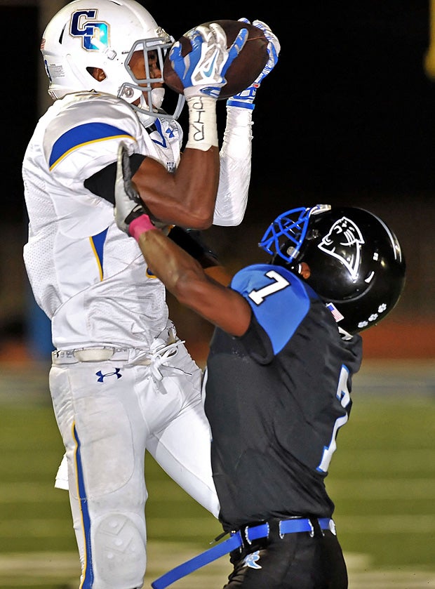 A Diamond Ranch (Pomona, Calif.) receiver goes up to make the reception over Charter Oak (Covina, Calif.) defender Dareon Nash.