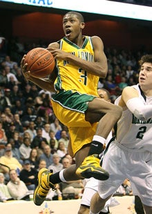 Kris Dunn is returning to the school he led to a state title in March.