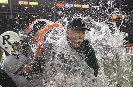 Palo Alto coach Earl Hansen gets doused following team's stunning victory. 