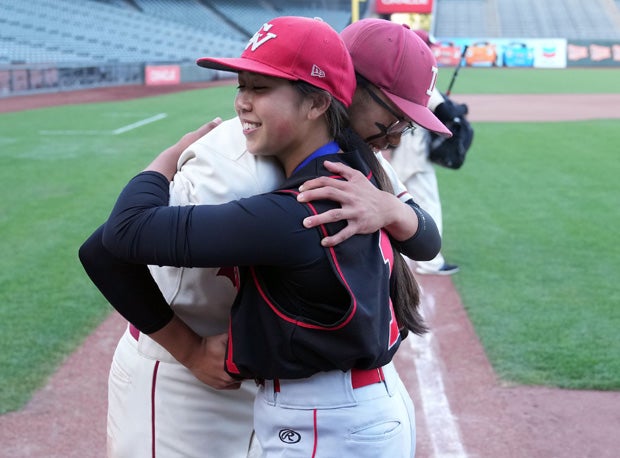Roman Fong (left) and Isabella Fong embrace well after Washington defeated seven-time defending champion Lowell for the San Francisco Section championship Tuesday at Oracle Park. 