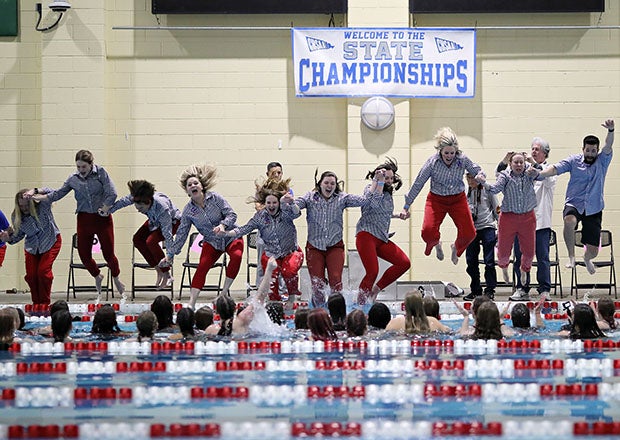 Cherry Creek coaches join their athletes in the pool after winning the Class 5A girls swimming state championship in Colorado. (PHOTO: Ray Chen)