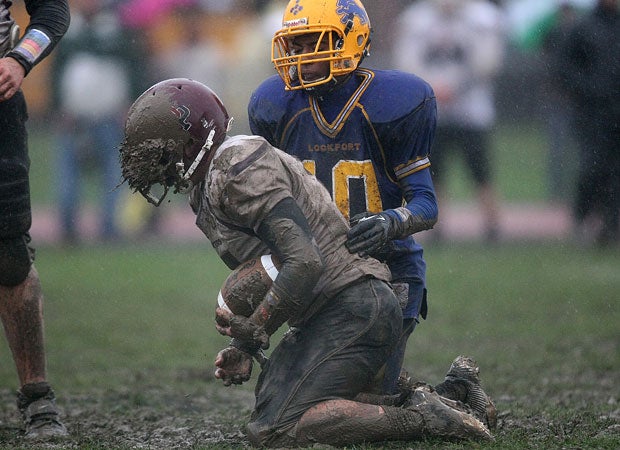 Rain left a muddy field at the Lockport vs. Orchard Park game in New York.  